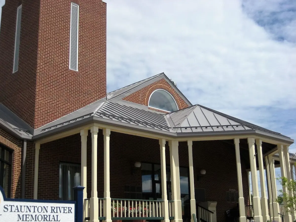 Skilled roofing craftsmen working on a residential roof in Jordanville